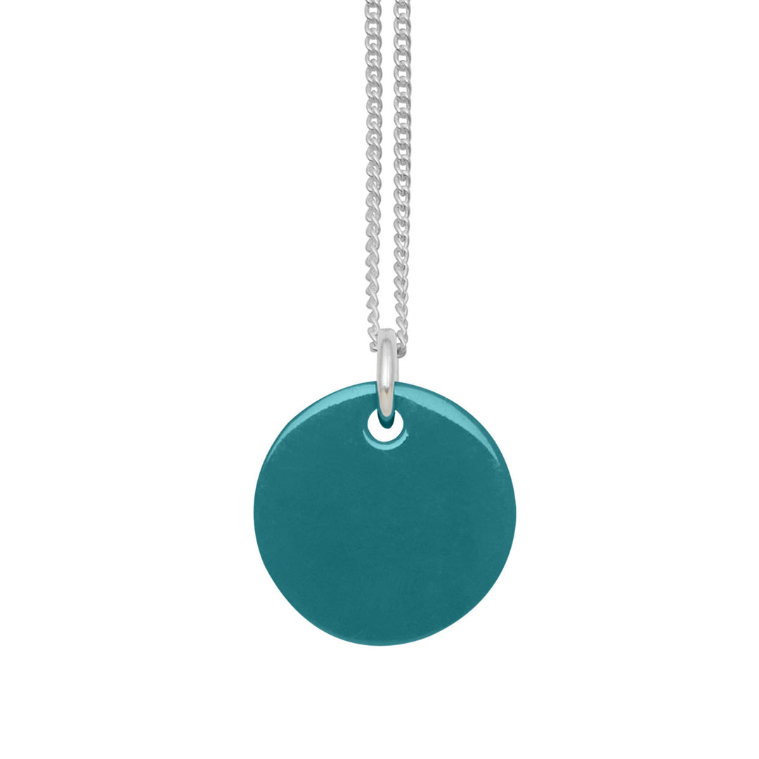 Branch Jewellery - small round reversable teal and black horn disc pendant on a sterling silver chain.