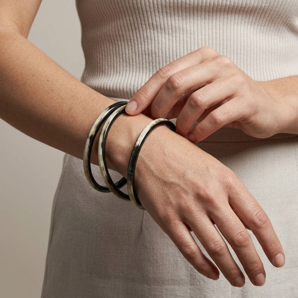 Zuri black natural buffalo horn set of three slim stacking bangles photographed for Branch Jewellery