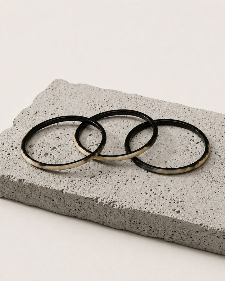 Zuri black natural buffalo horn set of three slim stacking bangles photographed for Branch Jewellery