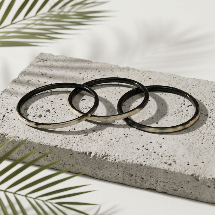 Zuri black natural buffalo horn set of three slim stacking bangles photographed for Branch Jewellery