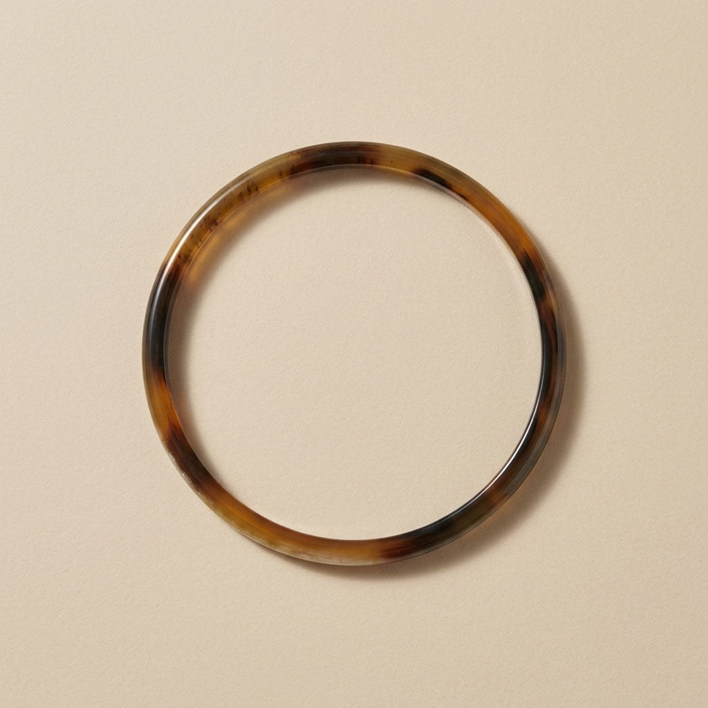 Zuri brown natural buffalo horn slim stacking bangle photographed for Branch Jewellery