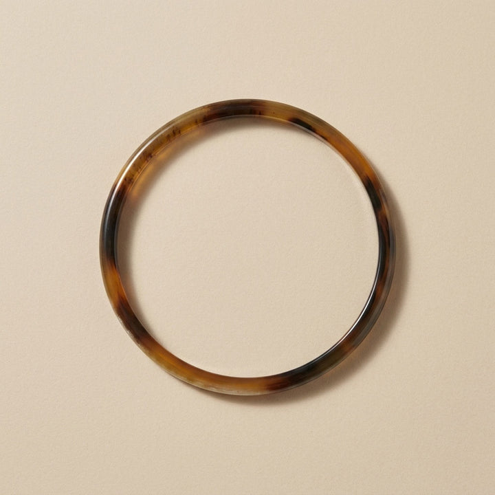 Zuri brown natural buffalo horn slim stacking bangle photographed for Branch Jewellery