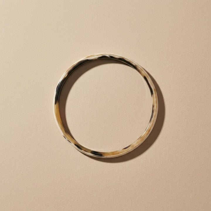 Zuri white natural buffalo horn slim stacking bangle photographed for Branch Jewellery