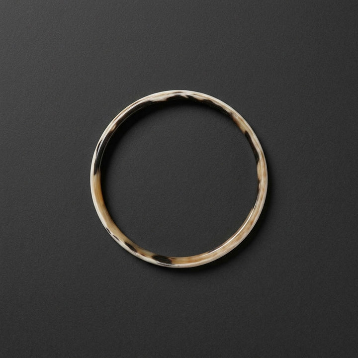 Zuri white natural buffalo horn slim stacking bangle photographed for Branch Jewellery