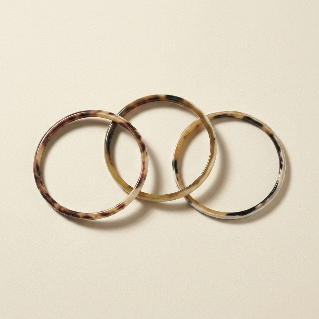 Zuri white natural buffalo horn set of three slim stacking bangles photographed for Branch Jewellery