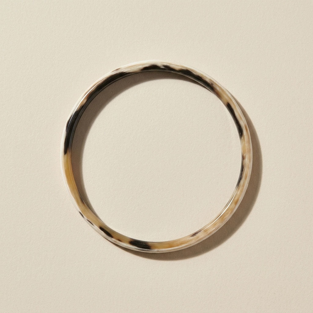 Zuri white natural buffalo horn slim stacking bangle photographed for Branch Jewellery