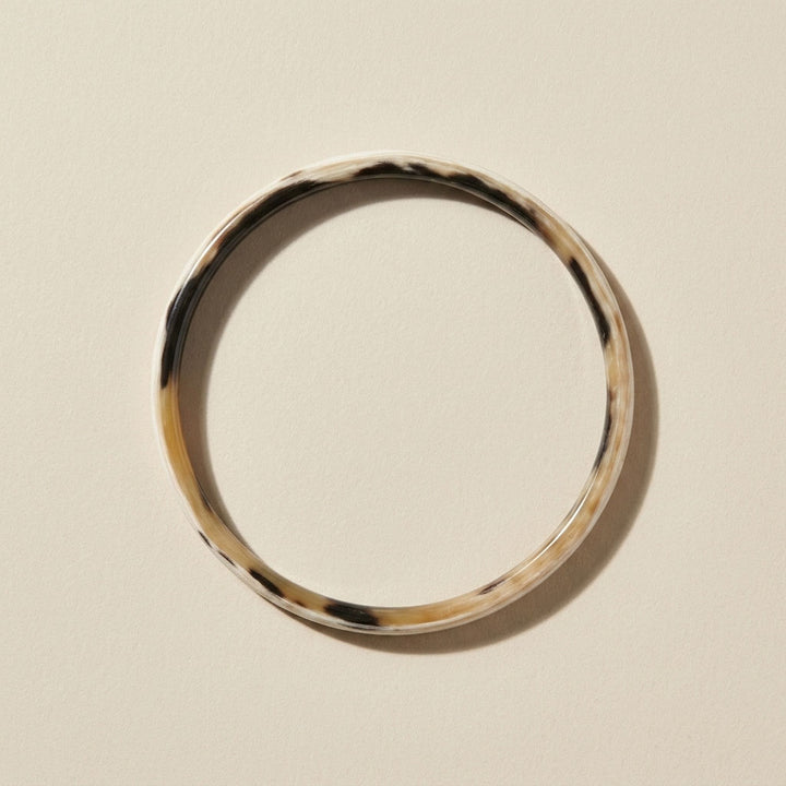 Zuri white natural buffalo horn slim stacking bangle photographed for Branch Jewellery