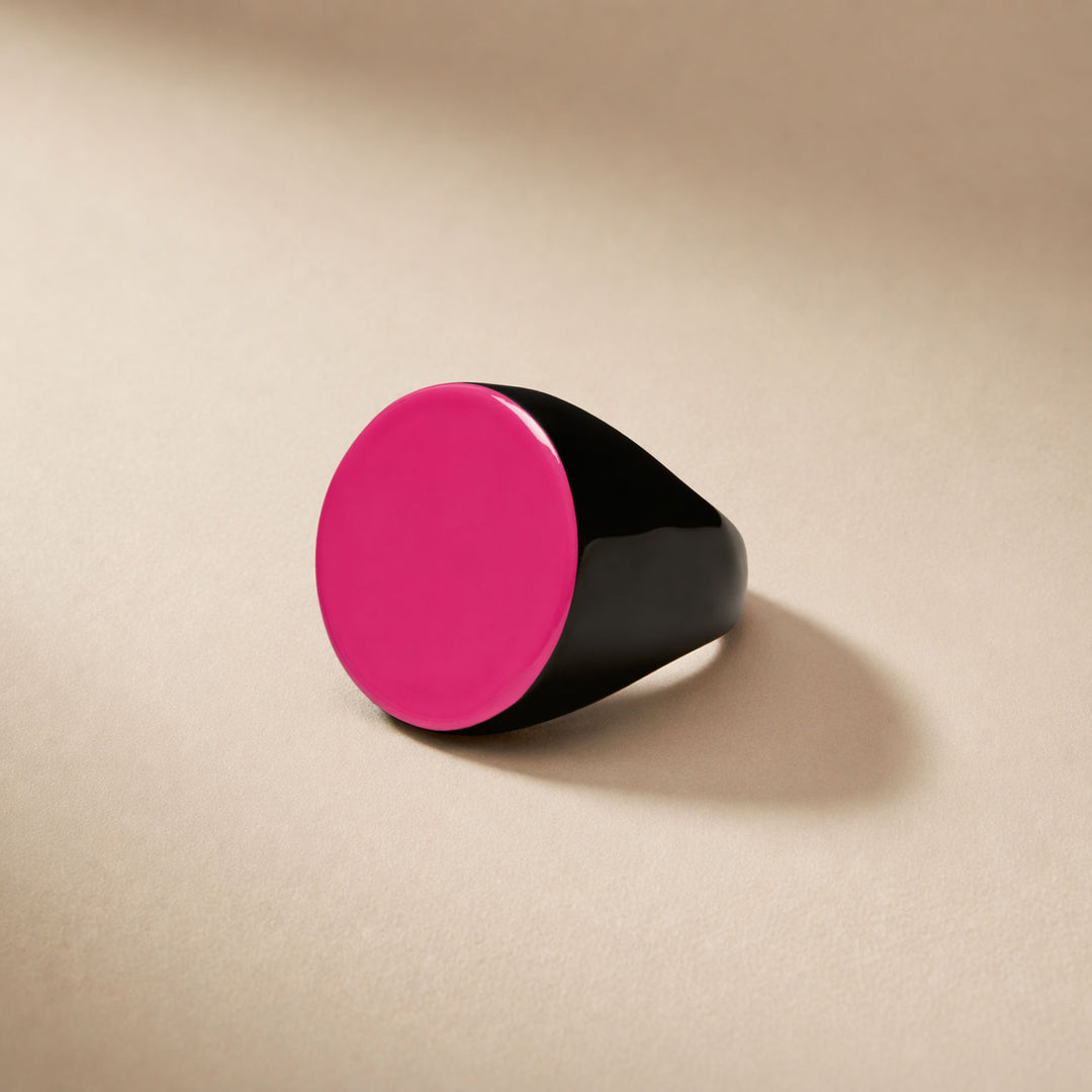 Branch Jewellery round horn statement cocktail ring with natural black horn base and a smooth fuchsia pink lacquered round top.