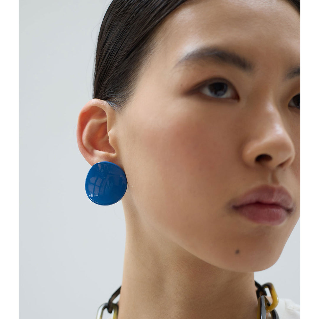 Bright blue curved stud earrings