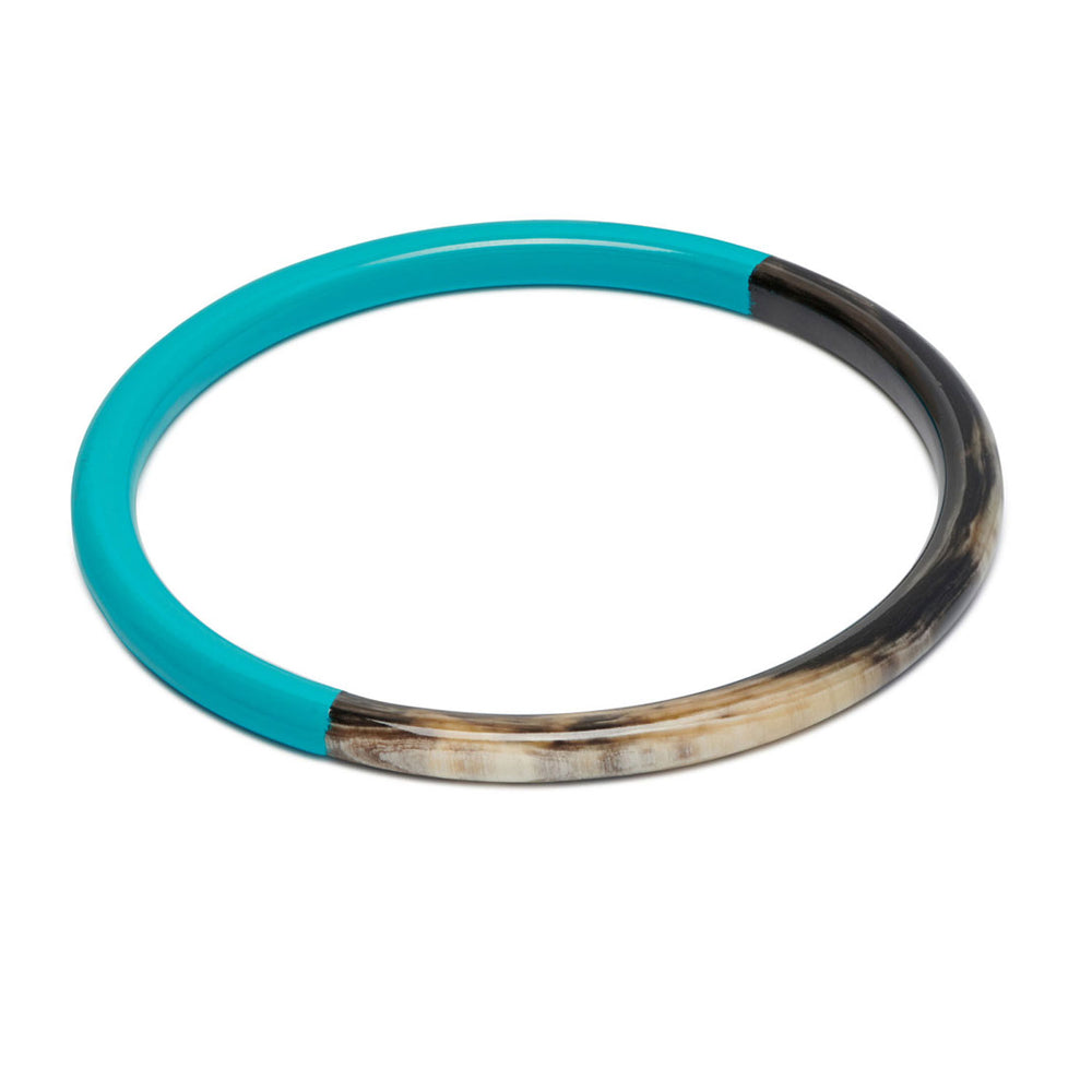 Branch Jewellery slim rounded black natural horn bangle with Turquoise Blue Lacquer. Half of the bangle is natural black horn and half is covered in a smooth Turquoise Blue lacquer.