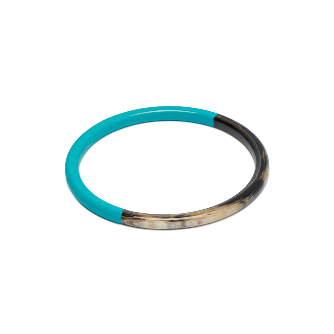 Branch Jewellery slim rounded black natural horn bangle with Turquoise Blue Lacquer. Half of the bangle is natural black horn and half is covered in a smooth Turquoise Blue lacquer.
