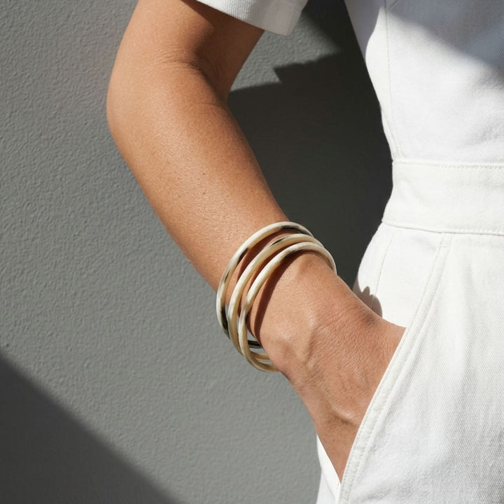 Zuri white natural buffalo horn set of three slim stacking bangles, handmade by Branch Jewellery