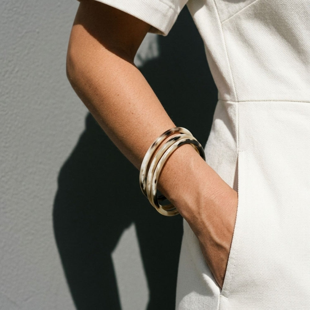 Zuri white natural buffalo horn set of three slim stacking bangles, handmade by Branch Jewellery