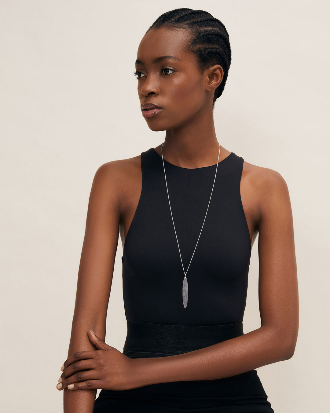 Branch Jewellery - long grey natural oval horn pendant on a sterling silver chain.