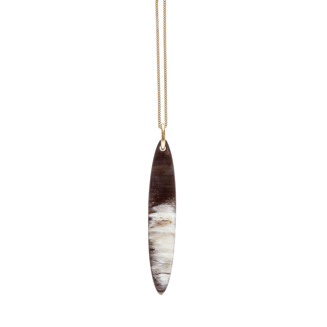 Branch Jewellery - long  black natural oval horn pendant on a gold plated silver chain.