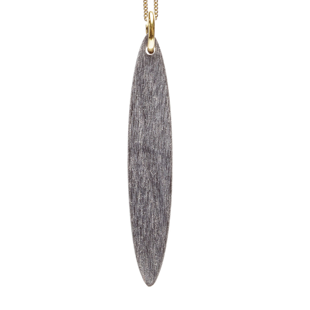 Branch Jewellery - Grey natural oval horn pendant on a gold plated silver chain.