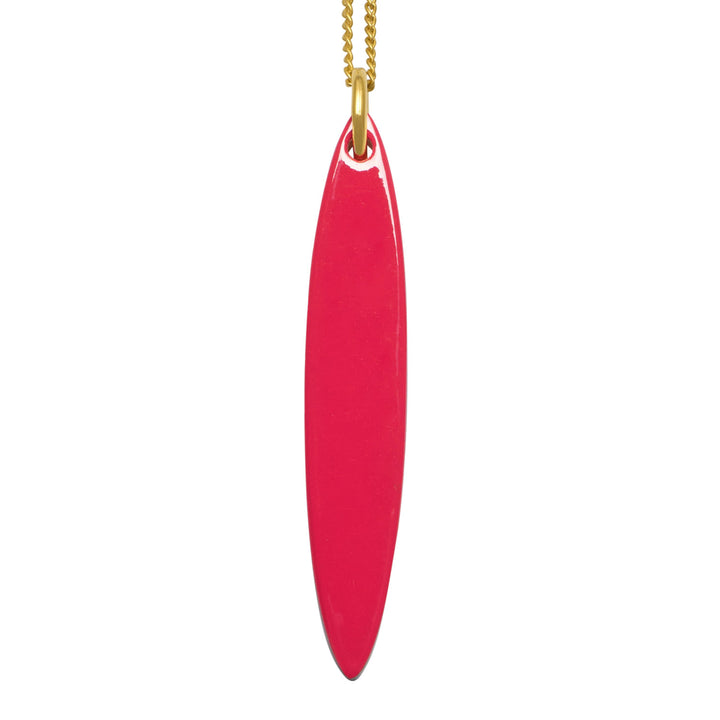 Branch Jewellery - long red and black natural reversable oval horn pendant on a gold plated silver chain.
