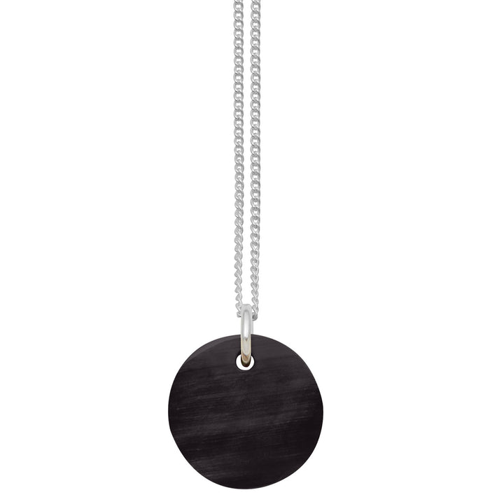 Branch Jewellery - small round reversable teal and black horn disc pendant on a sterling silver chain.