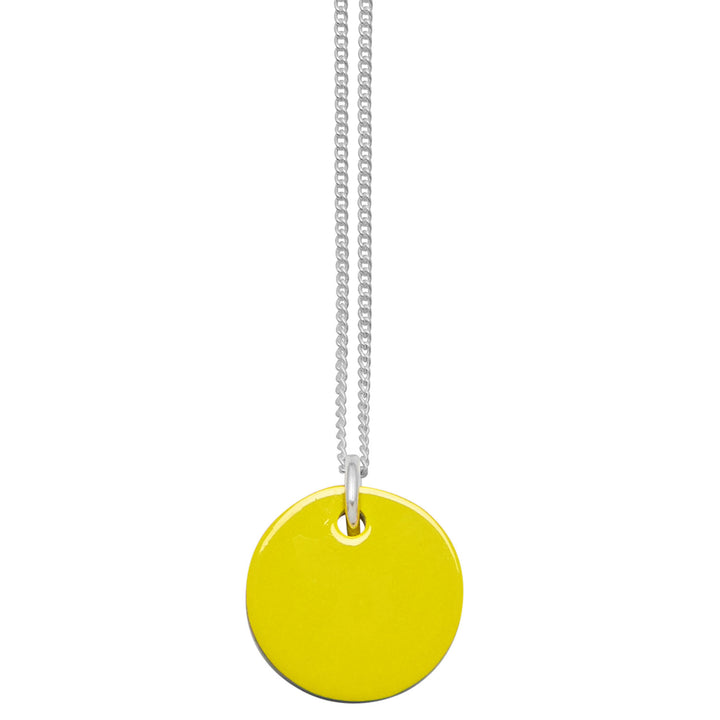 Branch Jewellery - small round reversable yellow and black horn disc pendant on a sterling silver chain.