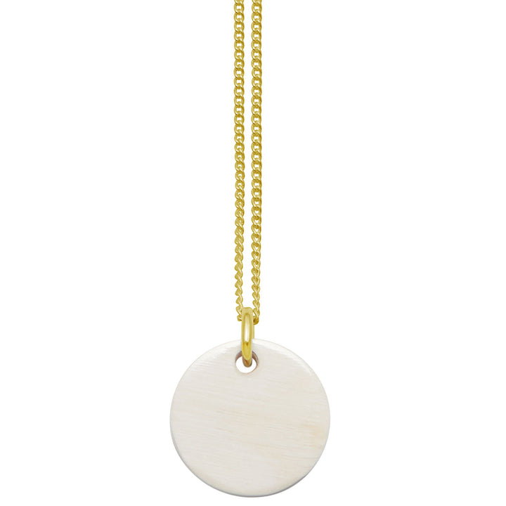 Branch Jewellery - small round reversable pink and white natural natural horn disc pendant on a gold plated silver chain.