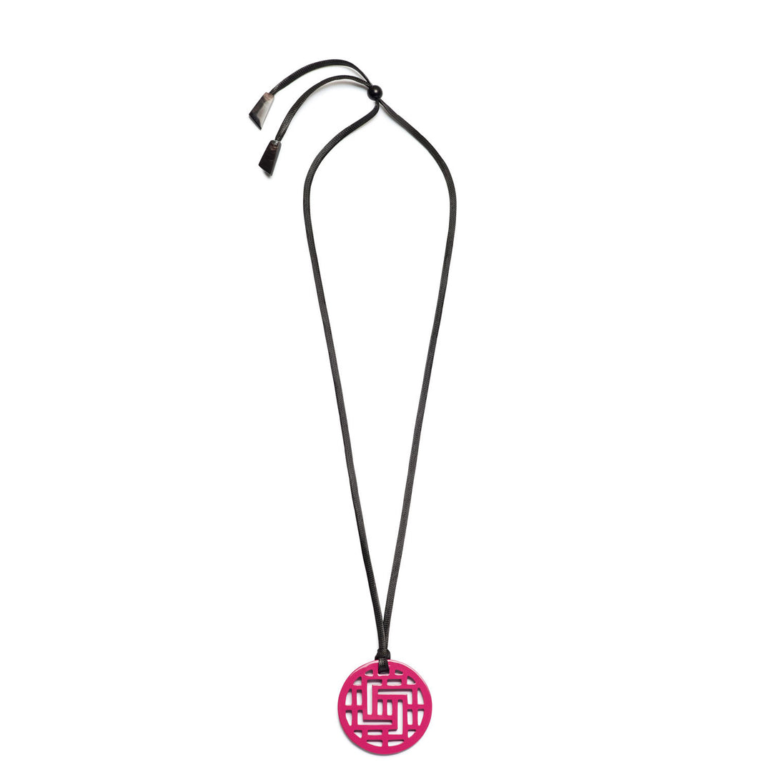Branch Jewellery Moko Geometric Patterned Fuschia Pink Round cut-out Horn Pendant on black adjustable cord.