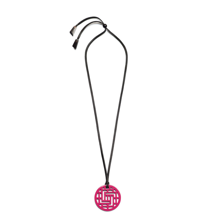 Branch Jewellery Moko Geometric Patterned Fuschia Pink Round cut-out Horn Pendant on black adjustable cord.