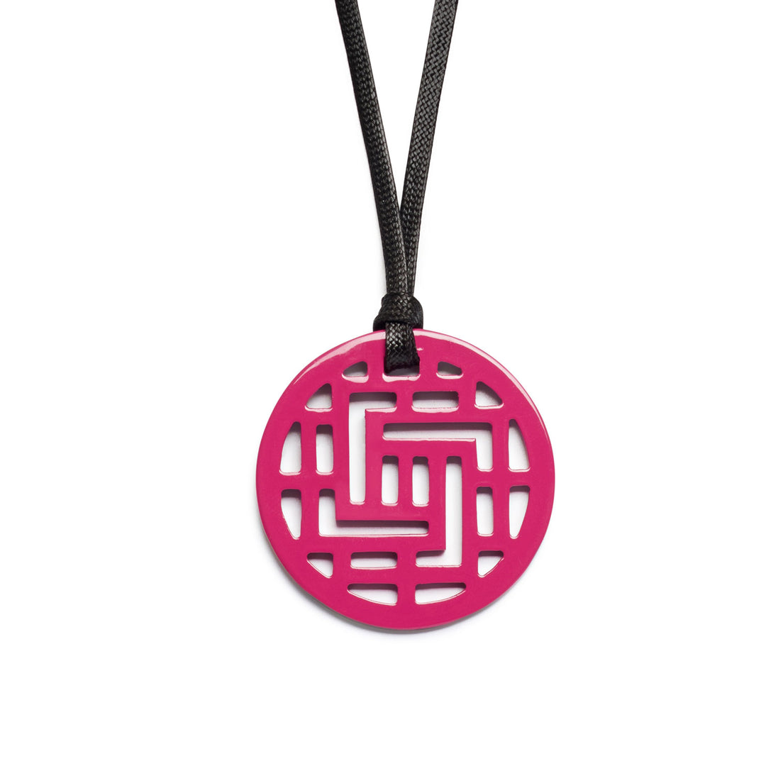 Branch Jewellery Moko Geometric Patterned Fuschia Pink Round cut-out Horn Pendant on black adjustable cord.