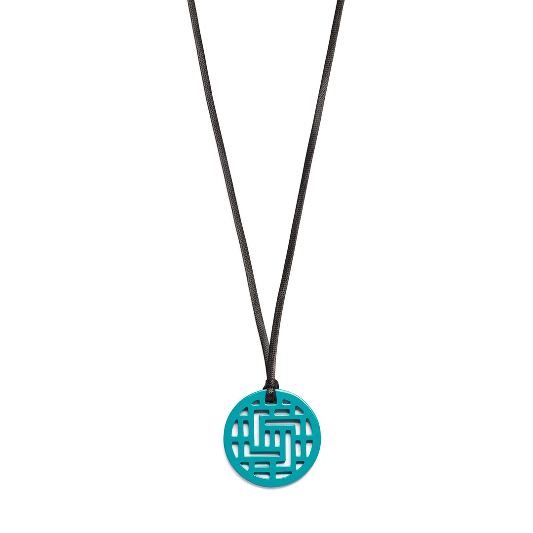 Branch Jewellery Moko Geometric Patterned Turquoise Blue Round cut-out Horn Pendant on black adjustable cord.