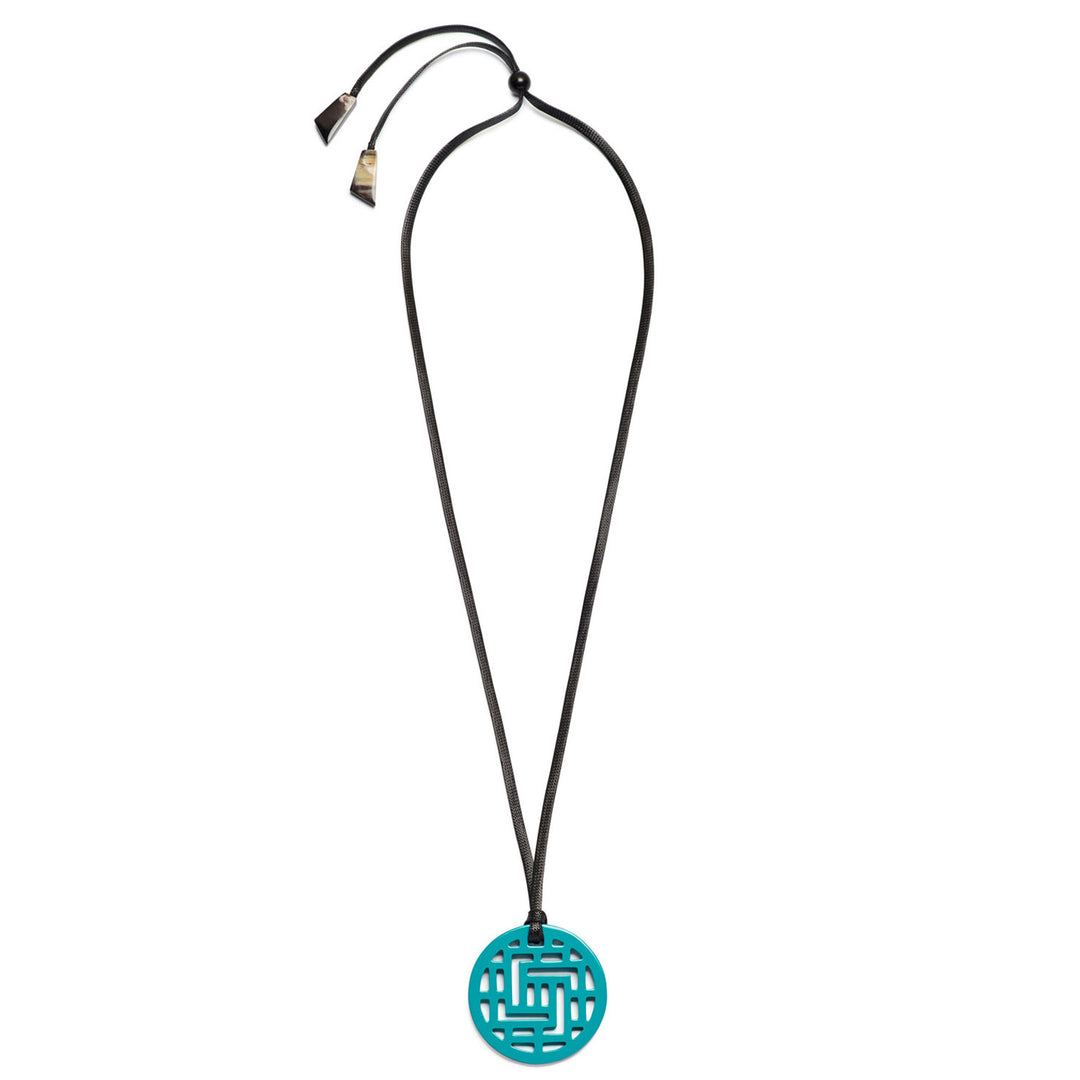 Branch Jewellery Moko Geometric Patterned Turquoise Blue Round cut-out Horn Pendant on black adjustable cord.