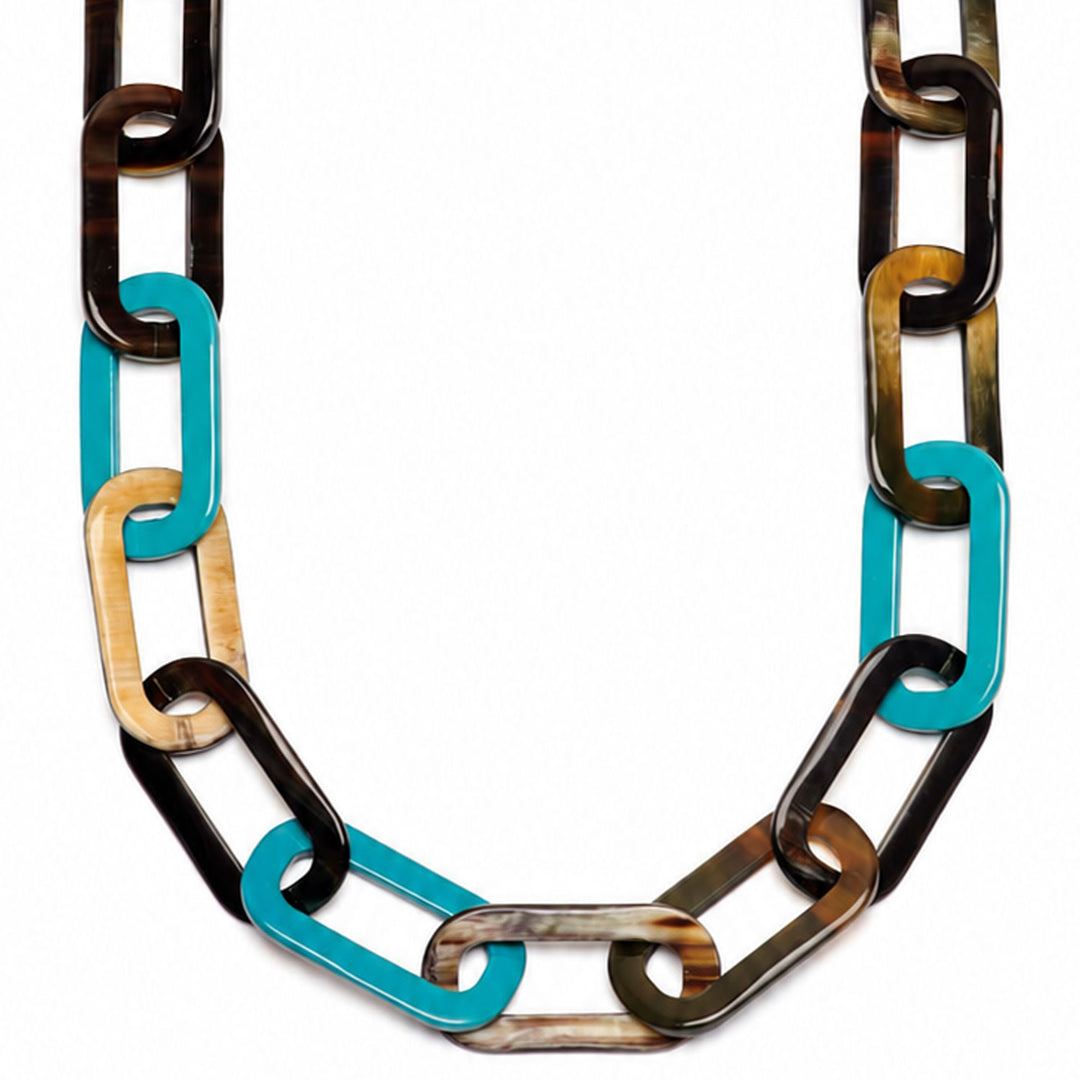 The Bright Turquoise Blue and Black Natural Large Rectangle Link Necklace by Branch Jewellery is handmade with interlocking links in black, tan, brown, and blue, featuring a toggle clasp for easy wear.