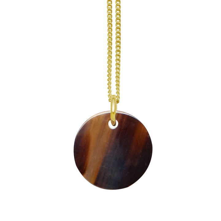 Branch Jewellery - small round brown natural horn disc pendant on a gold plated silver chain.